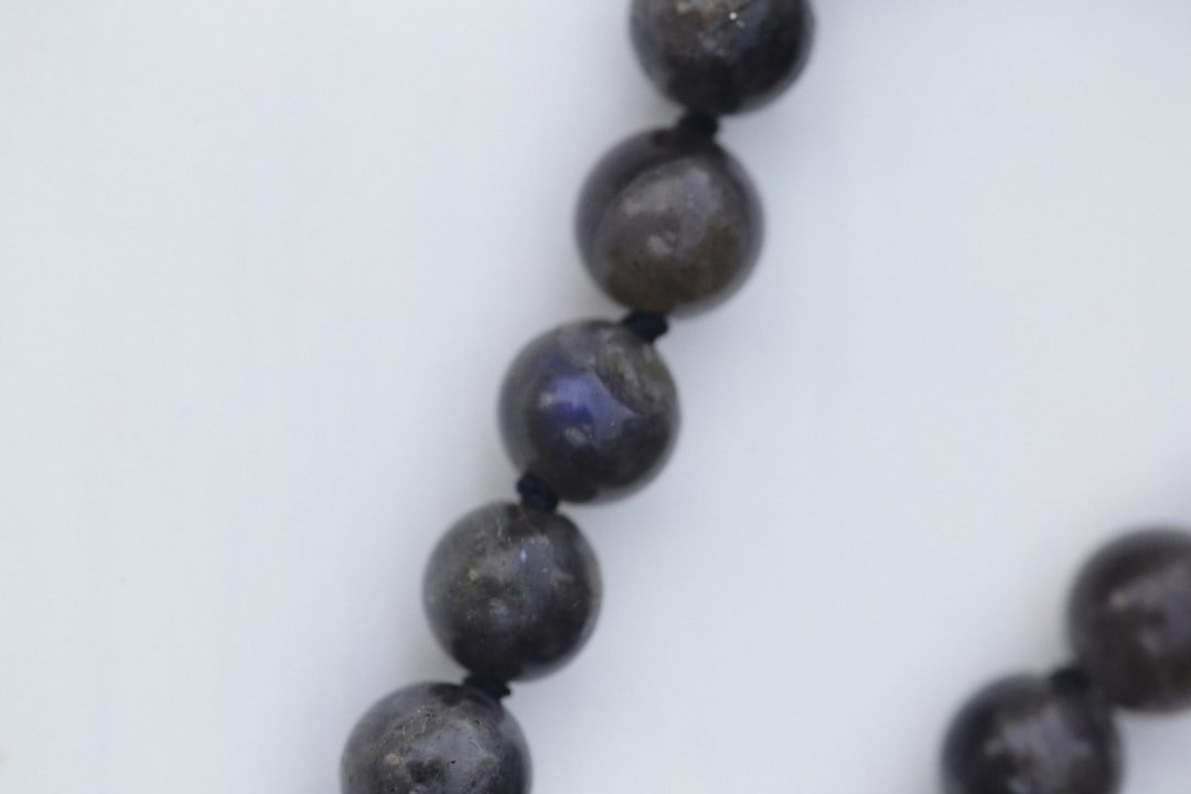 Close-up photograph of weld bead showing scattered porosity defects with visible gas pockets throughout the weld metal